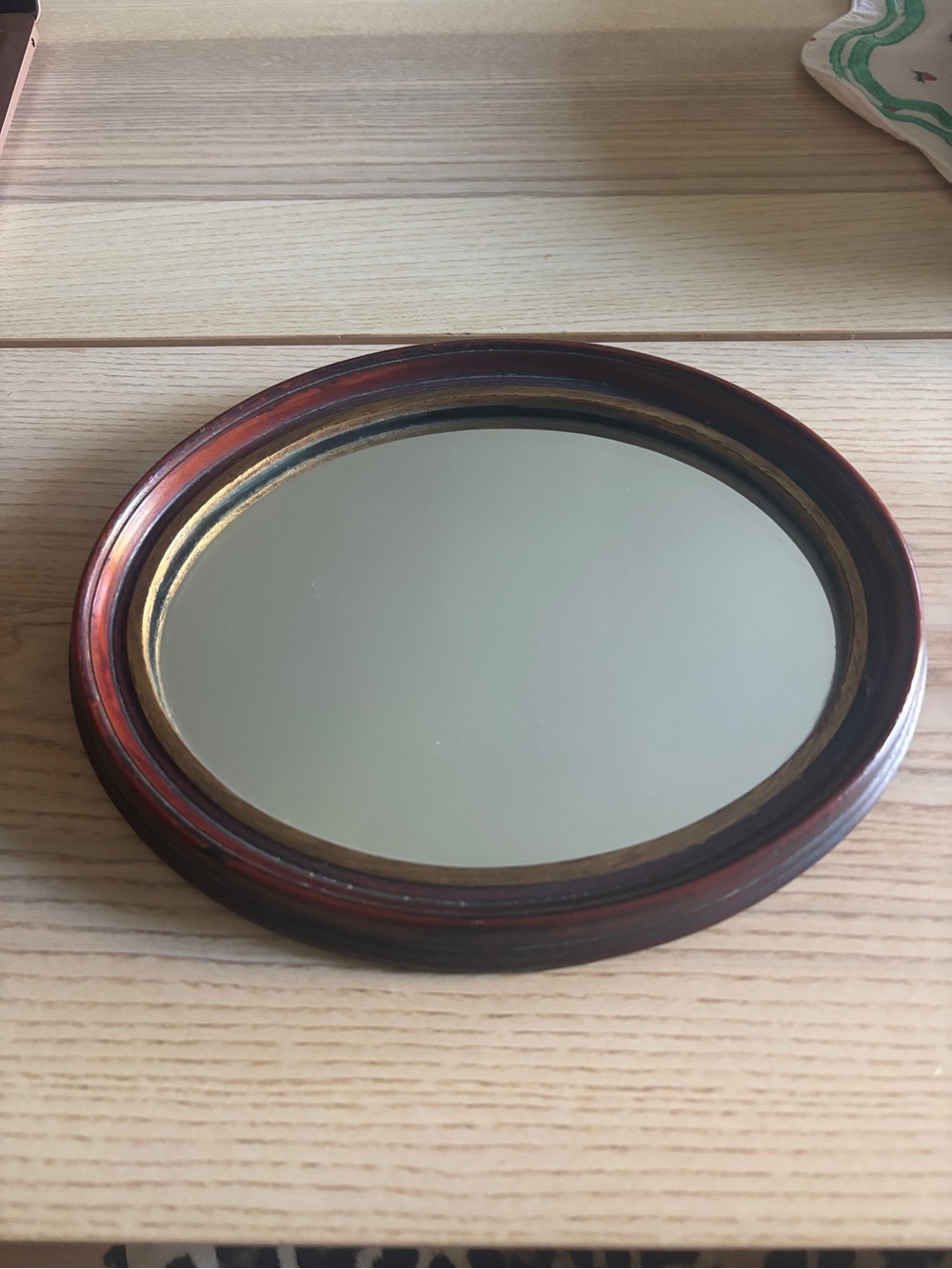 Round Wall Mirror with Dark Wood and Gold Accent